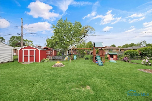 1137 Rosedale St, Maumee, OH 43537 - view of yard featuring a playground and an outdoor fire pit