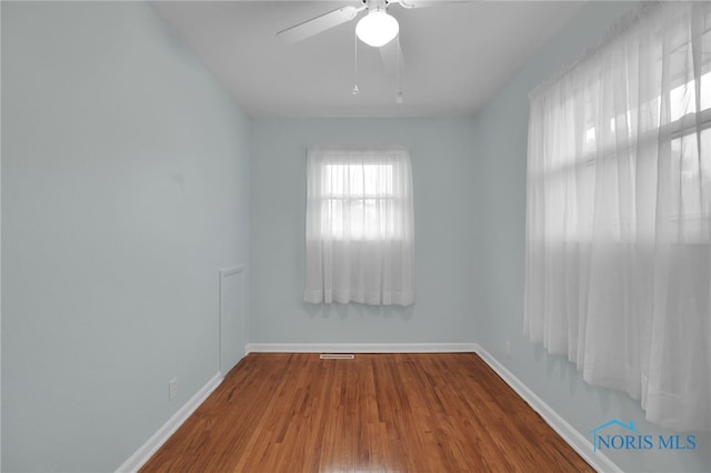 1137 Rosedale St, Maumee, OH 43537 - empty room featuring baseboards, wood finished floors, and ceiling fan