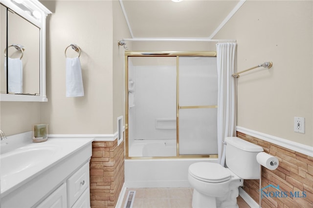 1137 Rosedale St, Maumee, OH 43537 - full bathroom with a wainscoted wall, toilet, vanity, shower / tub combo with curtain, and tile patterned floors