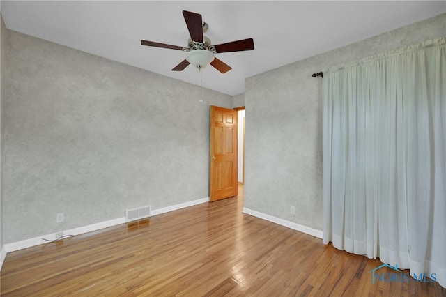 1137 Rosedale St, Maumee, OH 43537 - spare room with wood finished floors, ceiling fan, and baseboards