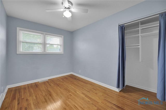 1137 Rosedale St, Maumee, OH 43537 - unfurnished bedroom featuring wood finished floors, a closet, baseboards, and a ceiling fan
