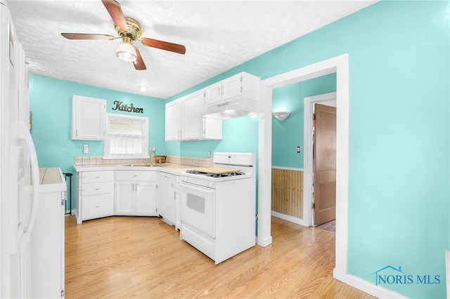 4835 291st St, Toledo, OH 43611 - kitchen with white appliances, under cabinet range hood, white cabinetry, light wood-style flooring, and a textured ceiling