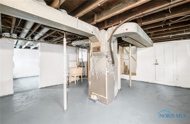4835 291st St, Toledo, OH 43611 - unfinished basement with heating unit and a sink