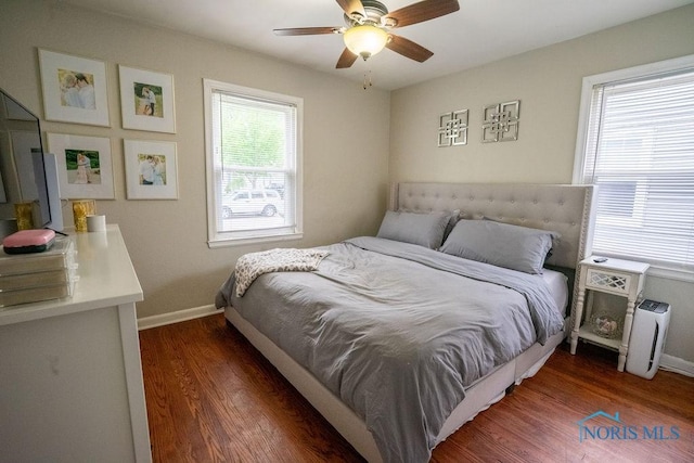 bedroom featuring baseboards, a ceiling fan, and wood finished floors