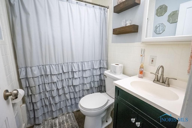 bathroom with vanity, toilet, tile walls, a shower with curtain, and backsplash