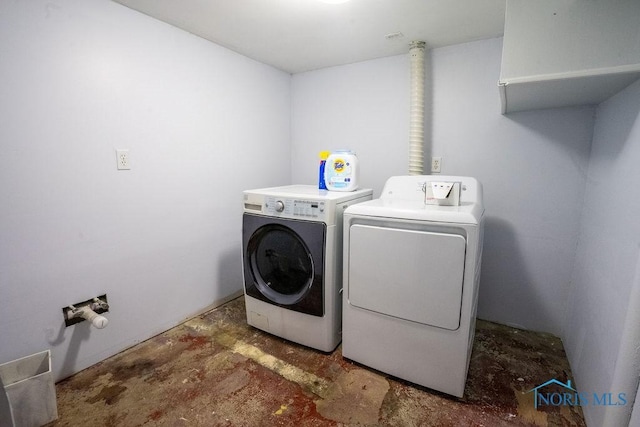 washroom with laundry area and washer and dryer