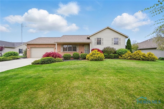 split level home with brick siding, a garage, a front yard, and concrete driveway