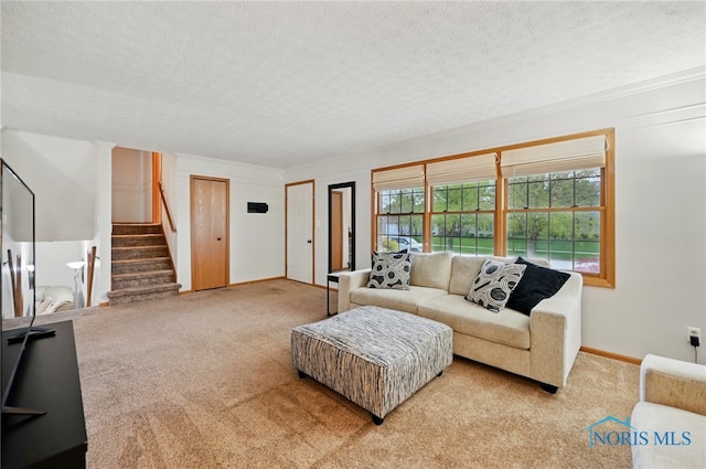 living room featuring carpet floors, a textured ceiling, and stairway