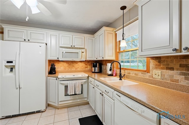 kitchen with a sink, white appliances, a ceiling fan, light tile patterned floors, and pendant lighting