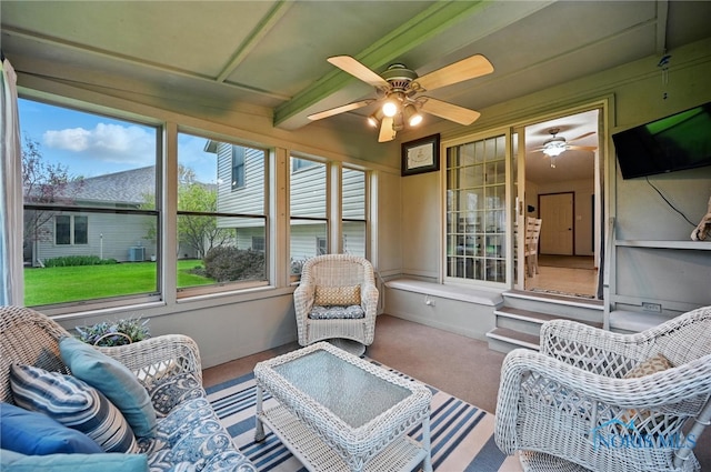 sunroom / solarium featuring ceiling fan