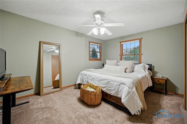 bedroom with baseboards, carpet, and ceiling fan