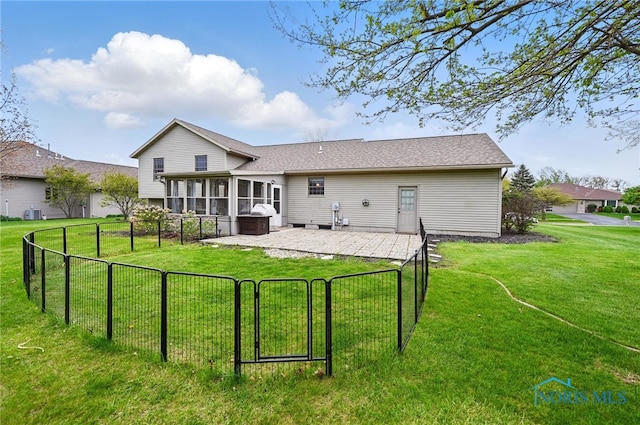 back of house featuring fence, a gate, a patio, and a yard