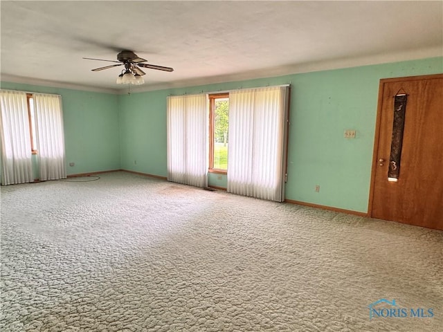 980 E Riverview Ave, Napoleon, OH 43545 - carpeted spare room featuring ceiling fan and baseboards