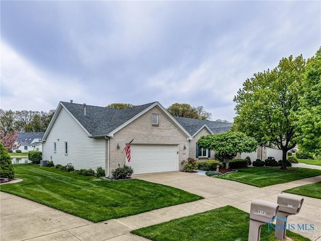 view of front of property with a shingled roof, an attached garage, brick siding, a front yard, and concrete driveway