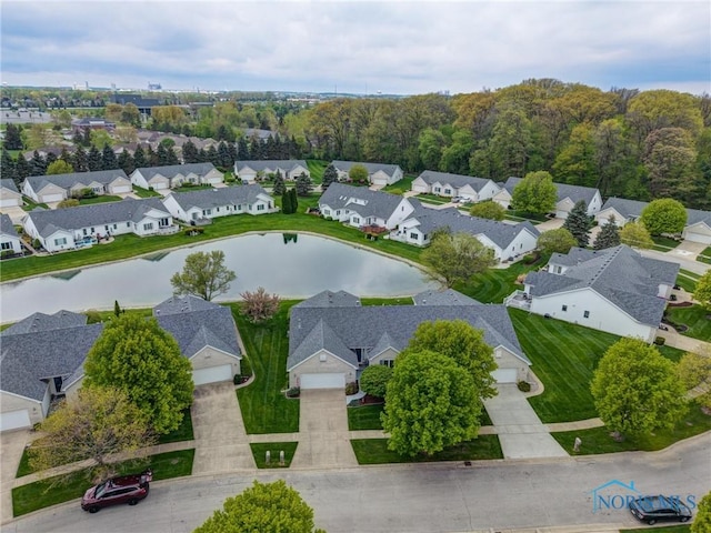 aerial view with a residential view and a water view