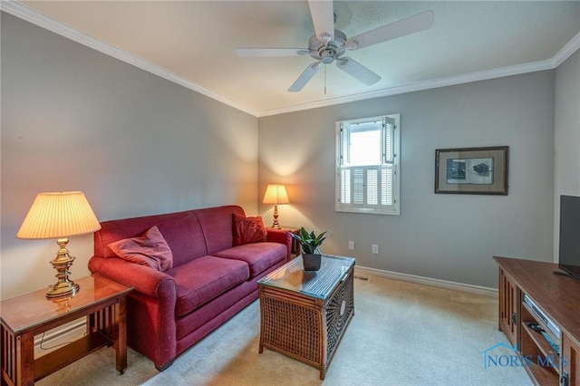 living area featuring crown molding, a ceiling fan, baseboards, and light colored carpet