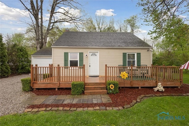 22020 Switzer Rd, Defiance, OH 43512 - back of house featuring a shingled roof, a deck, a garage, and a lawn