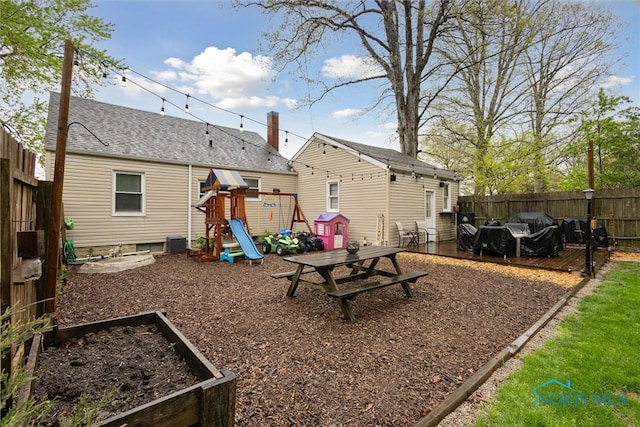 22020 Switzer Rd, Defiance, OH 43512 - back of property featuring a playground, fence, and a garden