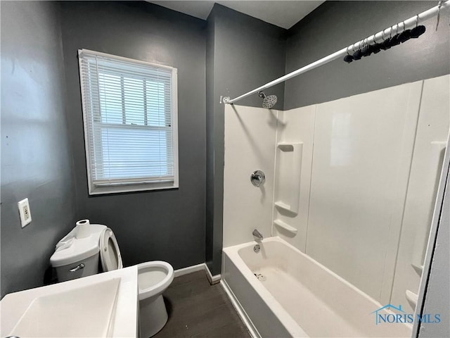 1741 Berkshire Pl, Toledo, OH 43613 - bathroom featuring toilet, baseboards, and shower / tub combination