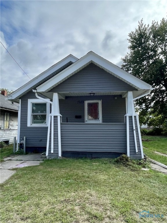 bungalow with a front yard