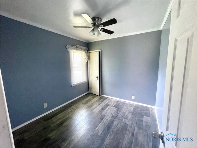 1949 Marlow Rd, Toledo, OH 43613 - unfurnished room featuring ceiling fan, dark wood-style floors, baseboards, and crown molding