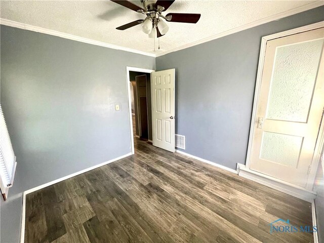 1949 Marlow Rd, Toledo, OH 43613 - unfurnished bedroom featuring dark wood-type flooring, crown molding, baseboards, a textured ceiling, and ceiling fan