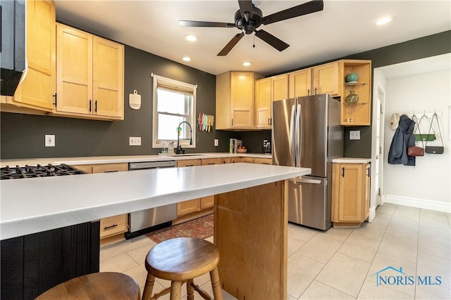 1407 Kenyon Dr, Toledo, OH 43614 - kitchen featuring appliances with stainless steel finishes, light brown cabinetry, a sink, light countertops, and recessed lighting