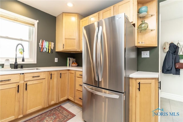 1407 Kenyon Dr, Toledo, OH 43614 - kitchen with freestanding refrigerator, light brown cabinets, a sink, light tile patterned floors, and recessed lighting