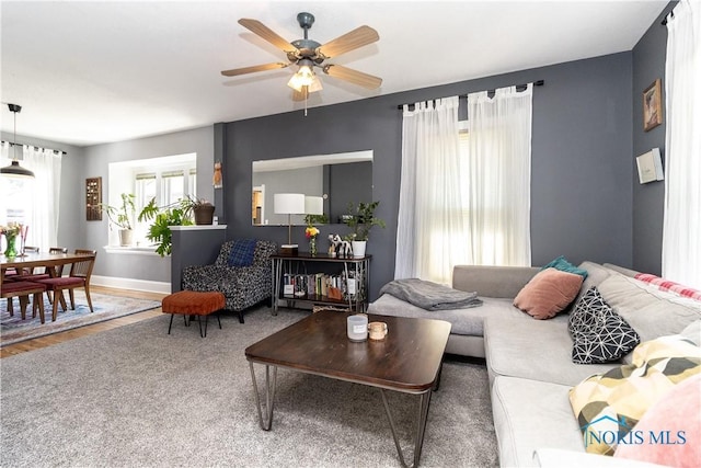 1407 Kenyon Dr, Toledo, OH 43614 - living room featuring a ceiling fan, baseboards, and wood finished floors