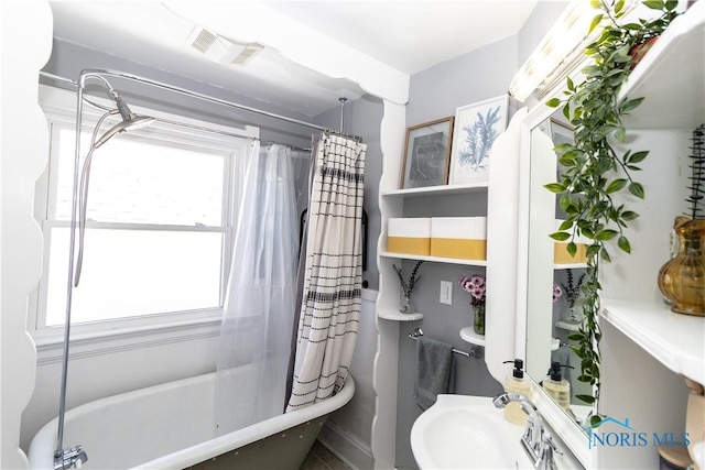 1407 Kenyon Dr, Toledo, OH 43614 - bathroom with a sink and shower / bath combo