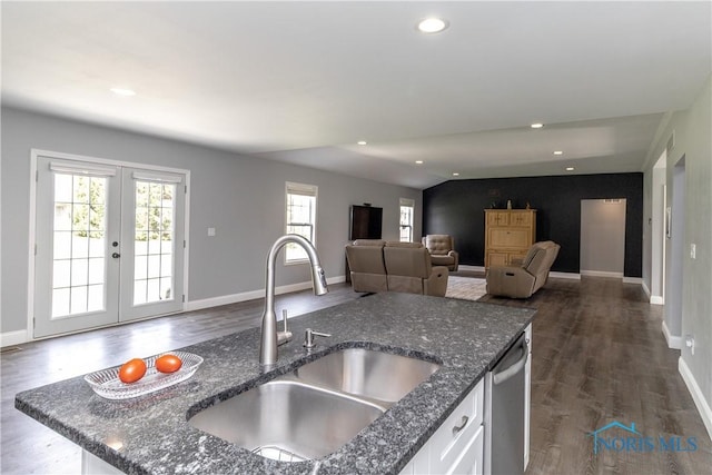 749 Parkside Dr, Wauseon, OH 43567 - kitchen featuring dishwasher, a sink, white cabinets, dark wood-style floors, and dark stone counters