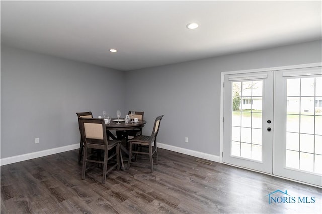 749 Parkside Dr, Wauseon, OH 43567 - dining area featuring baseboards, wood finished floors, visible vents, and french doors