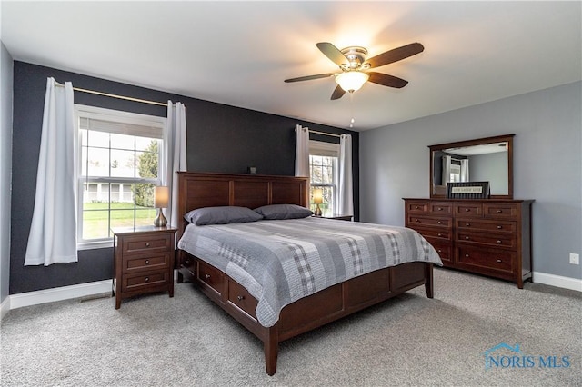 749 Parkside Dr, Wauseon, OH 43567 - bedroom featuring baseboards, multiple windows, and light carpet