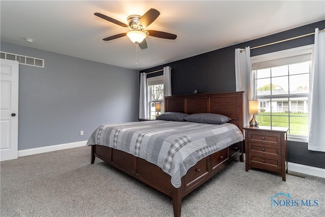 749 Parkside Dr, Wauseon, OH 43567 - bedroom featuring baseboards, ceiling fan, light carpet, and visible vents
