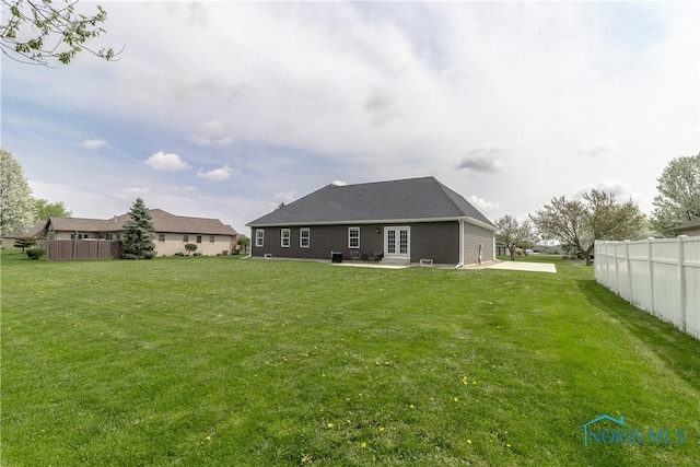 749 Parkside Dr, Wauseon, OH 43567 - back of house with french doors, fence, a patio, and a yard