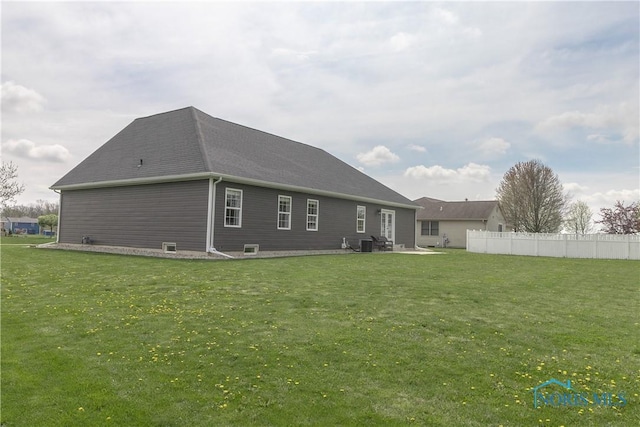 749 Parkside Dr, Wauseon, OH 43567 - rear view of house featuring a patio, central air condition unit, fence, and a yard