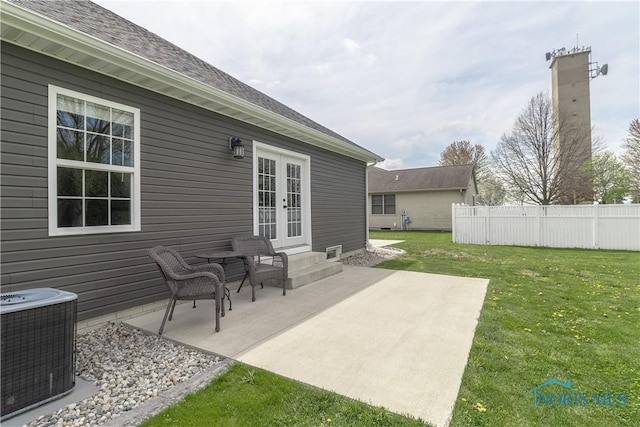 749 Parkside Dr, Wauseon, OH 43567 - view of patio with central air condition unit, fence, and french doors