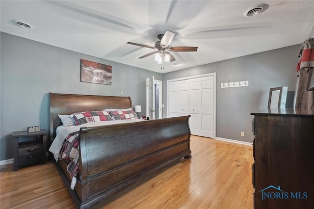 106 N Munson Rd, Swanton, OH 43558 - bedroom with baseboards, light wood-style flooring, and a ceiling fan