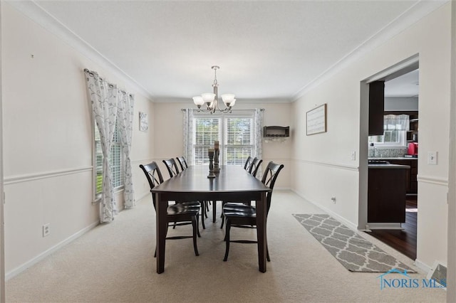 106 N Munson Rd, Swanton, OH 43558 - dining room featuring a chandelier, carpet flooring, crown molding, and baseboards
