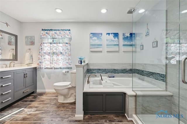 106 N Munson Rd, Swanton, OH 43558 - bathroom featuring wood finished floors, a shower stall, toilet, a bath, and recessed lighting