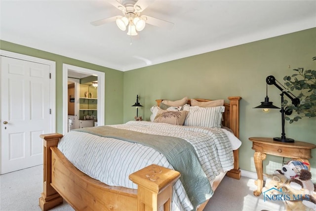 3766 Edgevale Rd, Toledo, OH 43606 - carpeted bedroom with a ceiling fan, connected bathroom, and baseboards