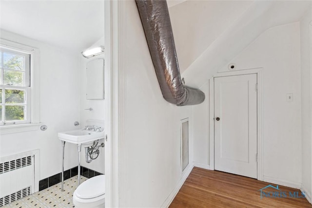 3766 Edgevale Rd, Toledo, OH 43606 - bathroom with radiator heating unit, wood finished floors, toilet, and vaulted ceiling