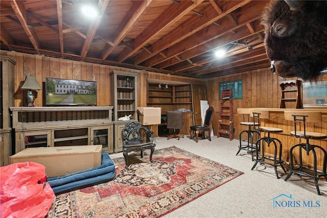 3766 Edgevale Rd, Toledo, OH 43606 - living room with wooden walls, carpet, and a dry bar