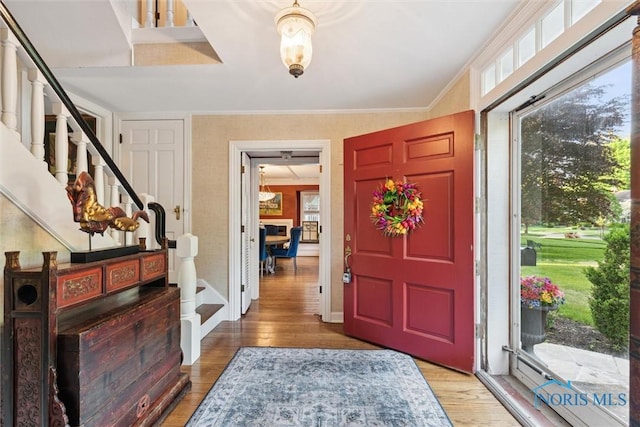 3766 Edgevale Rd, Toledo, OH 43606 - entrance foyer with light wood-style flooring, stairs, crown molding, and baseboards