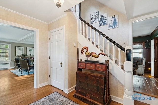 3766 Edgevale Rd, Toledo, OH 43606 - stairway with radiator heating unit, wood finished floors, crown molding, and baseboards