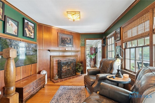 3766 Edgevale Rd, Toledo, OH 43606 - living area featuring a fireplace, crown molding, wood finished floors, and wooden walls
