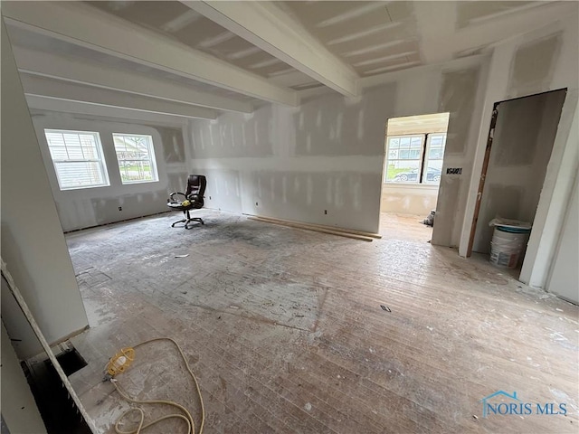 spare room with beamed ceiling
