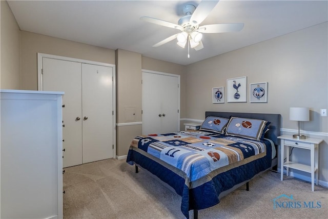 bedroom featuring baseboards, ceiling fan, carpet, and a closet