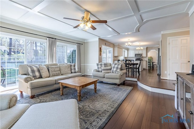 living area with baseboards, dark wood finished floors, ceiling fan with notable chandelier, and coffered ceiling