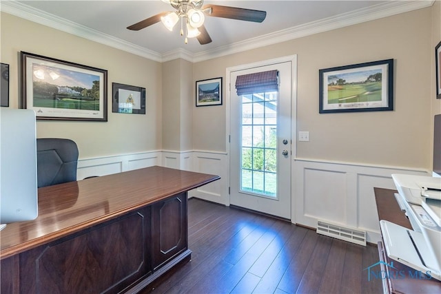 office space with ceiling fan, visible vents, a wainscoted wall, ornamental molding, and a decorative wall